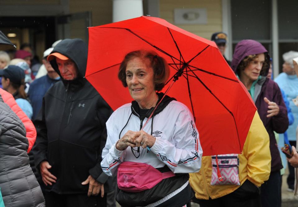 Diana Roberts, of Milton, readies her umbrella at the start of the Milton Council on Aging's Fit for Life Walk on Saturday, Oct. 1, 2022.