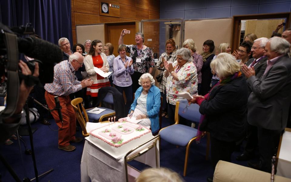 Cast and crew celebrate June's 100th birthday with her in the studio