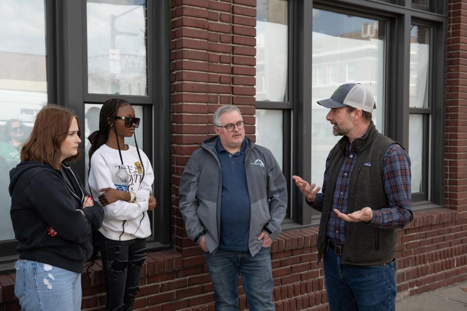 Jeremy Caron, center, led the team that developed the ADAPT DSM climate plan.