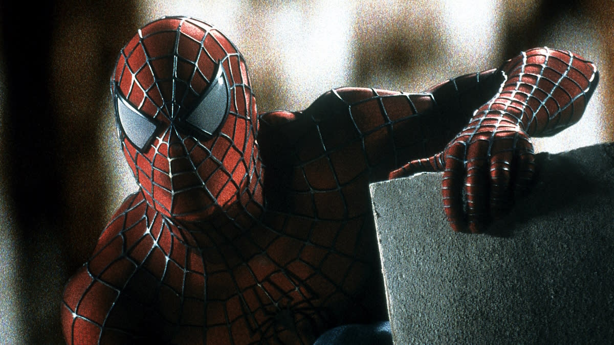  Spider-Man sits on a rooftop in Spider-Man. 