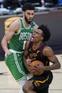 Cleveland Cavaliers' Collin Sexton, right, drives against Boston Celtics' Jayson Tatum during the second half of an NBA basketball game Wednesday, May 12, 2021, in Cleveland. (AP Photo/Tony Dejak)