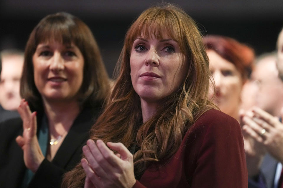Angela Rayner, right, deputy Labor Party leader, applauds as Keir Starmer, the leader of Britain's Labour Party makes his speech at the party's annual conference in Liverpool, England, Tuesday, Sept. 27, 2022. (AP Photo/Jon Super)