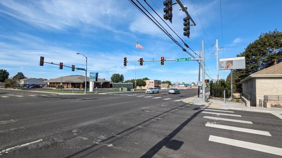 Police closed this intersection at Court Street and Road 36 after a man allegedly charged officers with a machete and was shot and killed.