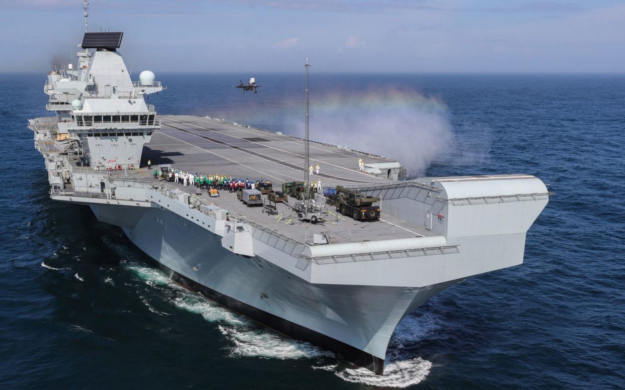 HMS Queen Elizabeth begins its maiden deployment to the Indo-Pacific region this month - PA