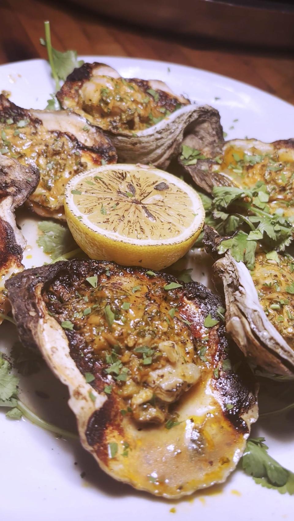 Charbroiled oysters at the Brother Fox restaurant in Pensacola, Florida, on Wednesday, Dec. 20, 2023.