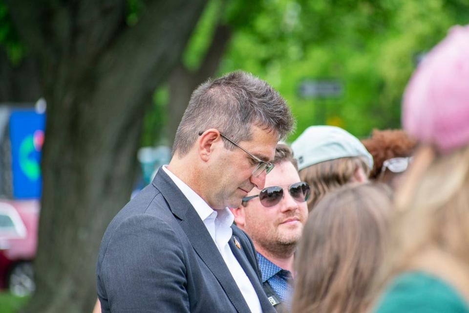 New Castle County Executive Matt Meyer stands with supporters during a protest outside Legislative Hall calling on legislators to override the governor's veto of House Bill 371 on Tuesday, June 7, 2022.