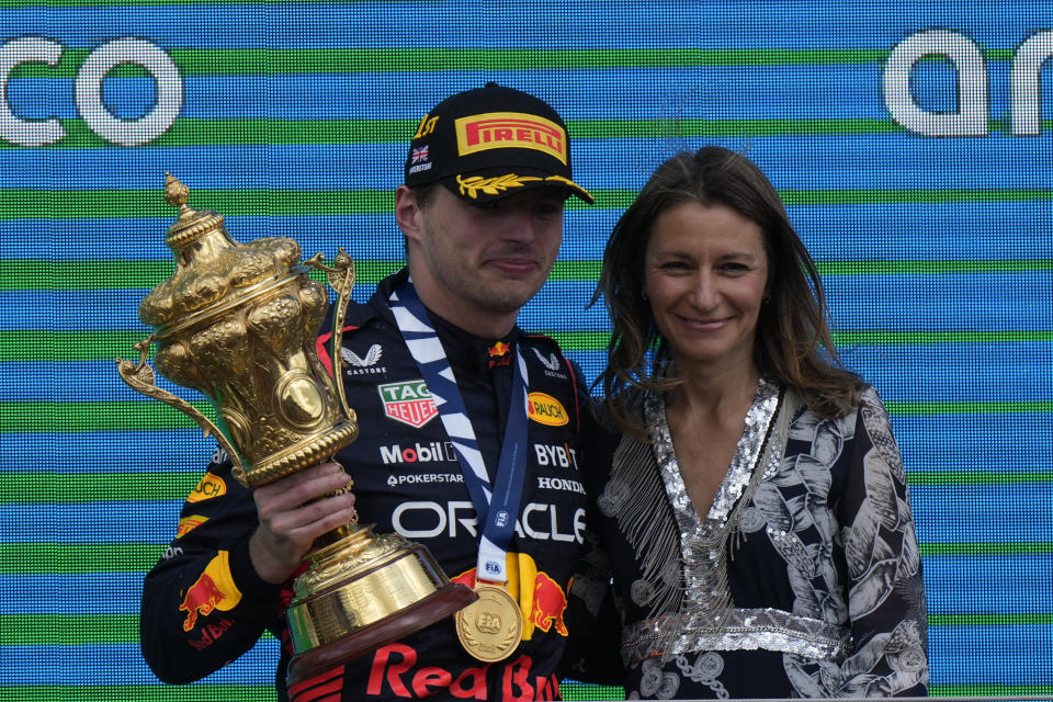Red Bull driver Max Verstappen of the Netherlands, left, poses with Lucy Frazer, Secretary of State for Culture, Media and Sports after the British Formula One Grand Prix race at the Silverstone racetrack, Silverstone, England, Sunday, July 9, 2023. (AP Photo/Luca Bruno)