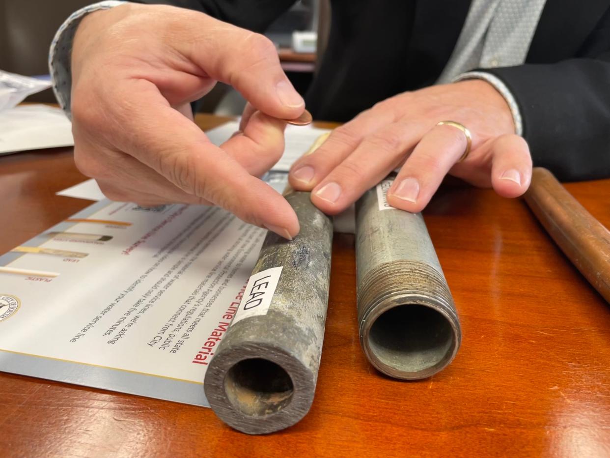 South Bend Public Works Director Eric Horvath prepares to perform a scratch test on a lead pipe on Tuesday, Feb. 6, 2024.