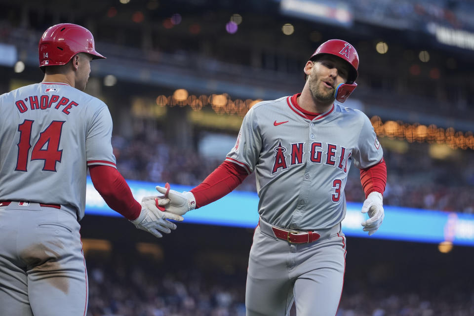 Los Angeles Angels' Taylor Ward, right, celebrates with Logan O'Hoppe after scoring against the San Francisco Giants during the third inning of a baseball game Friday, June 14, 2024, in San Francisco. (AP Photo/Godofredo A. Vásquez)