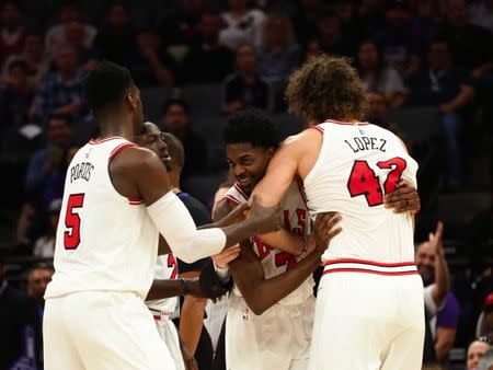 Feb 5, 2018; Sacramento, CA, USA; Chicago Bulls guard Justin Holiday (7) holds back center Robin Lopez (42) after he was ejected from the game during the second quarter against the Sacramento Kings at Golden 1 Center. Mandatory Credit: Kelley L Cox-USA TODAY Sports