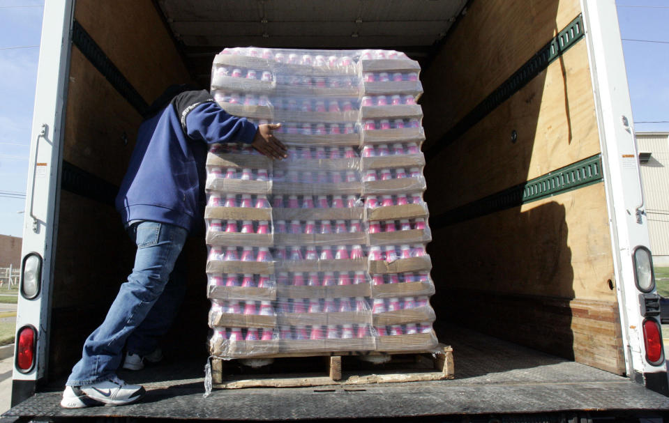 Minimum wage. A worker at the North Texas Foodbank loads a pallet of yogurt onto a truck in Dallas, Texas, November 20, 2006. REUTERS/Jessica Rinaldi (USA)