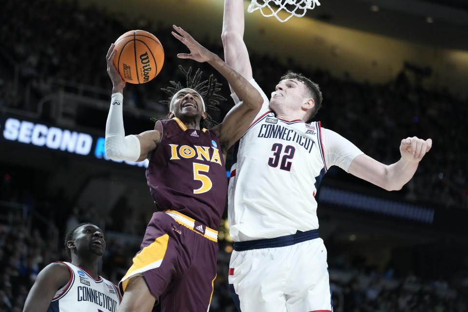 Iona's Daniss Jenkins (5) shoots against Connecticut's center Donovan Clingan (32) in the second half of a first-round college basketball game in the NCAA Tournament, Friday, March 17, 2023, in Albany, N.Y. (AP Photo/John Minchillo)
