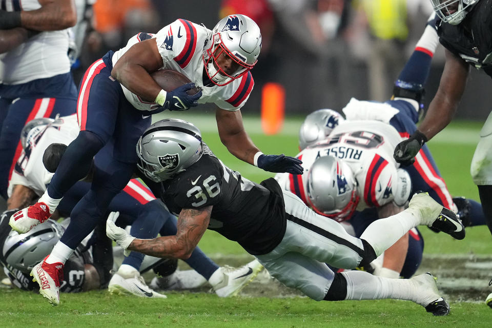 Aug 26, 2022; Paradise, Nevada, USA; New England Patriots running back Kevin Harris (36) is tackled by Las Vegas Raiders linebacker Curtis Bolton (36) during a preseason game at Allegiant Stadium. Mandatory Credit: Stephen R. Sylvanie-USA TODAY Sports