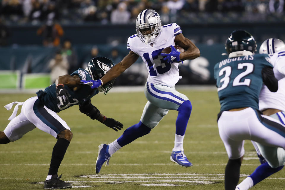 Philadelphia Eagles cornerback Jalen Mills, left, tries to stop Dallas Cowboys wide receiver Michael Gallup (13) during the first half of an NFL football game Sunday, Dec. 22, 2019, in Philadelphia. (AP Photo/Chris Szagola)