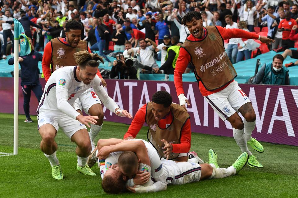 <p>England's players celebrate their second goal during the UEFA EURO 2020 round of 16 football match between England and Germany at Wembley Stadium in London on June 29, 2021. (Photo by Andy Rain / POOL / AFP) (Photo by ANDY RAIN/POOL/AFP via Getty Images)</p>
