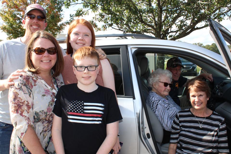 Centenarian Mabel Dorothy Duty Cook of Chesterfield poses with her family after voting at the Registrar's Office in Chesterfield on Oct. 15, 2020.