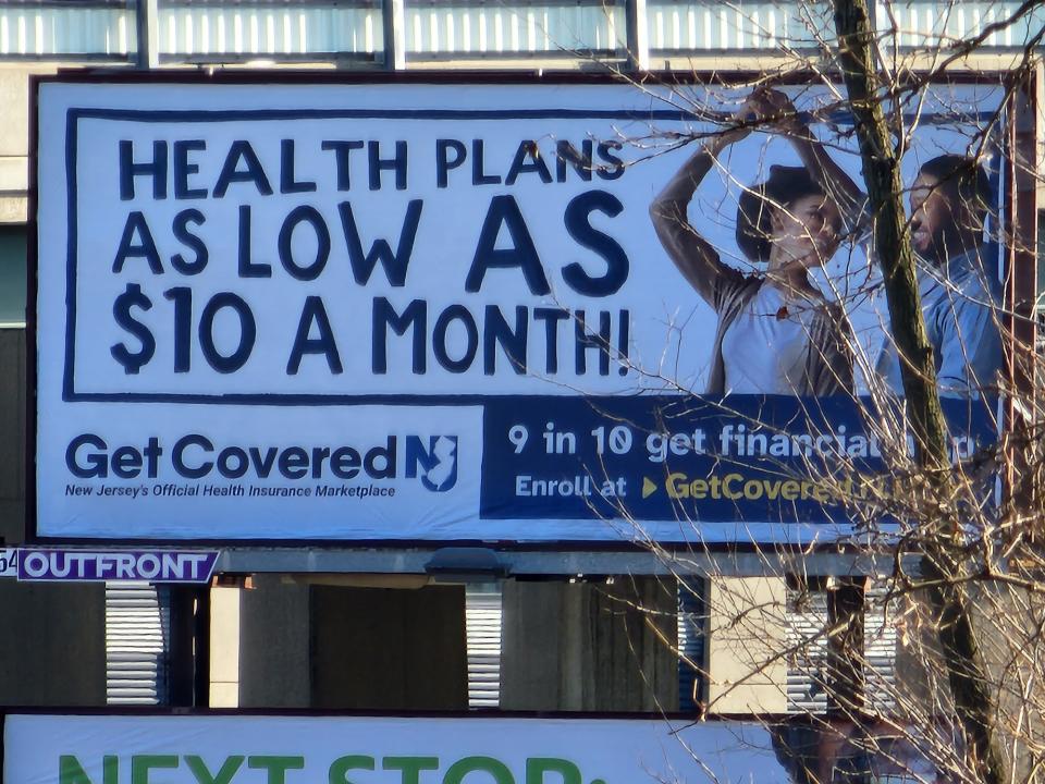 <p>A camera sample from the Galaxy S22 Ultra's zoom camera closing in on a sign a billboard on an overpass, showing the words "Health plans as low as $10 a month!"</p>
