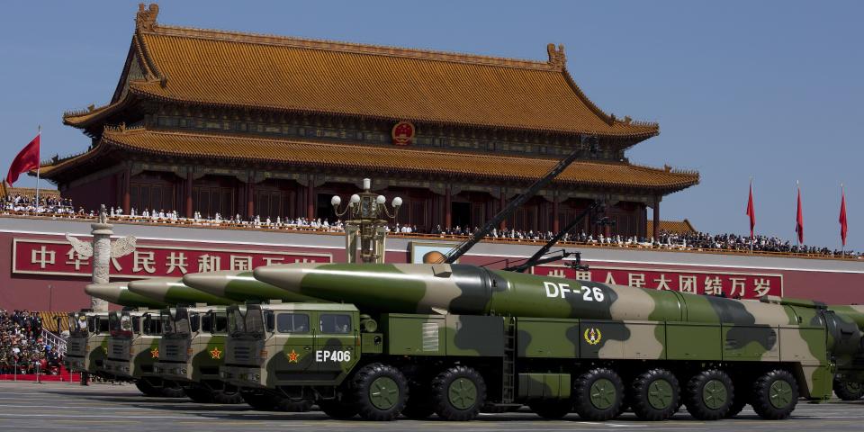 Military vehicles carrying DF-26 ballistic missiles, drive past the Tiananmen Gate during a military parade to mark the 70th anniversary of the end of World War Two on September 3, 2015, in Beijing, China.
