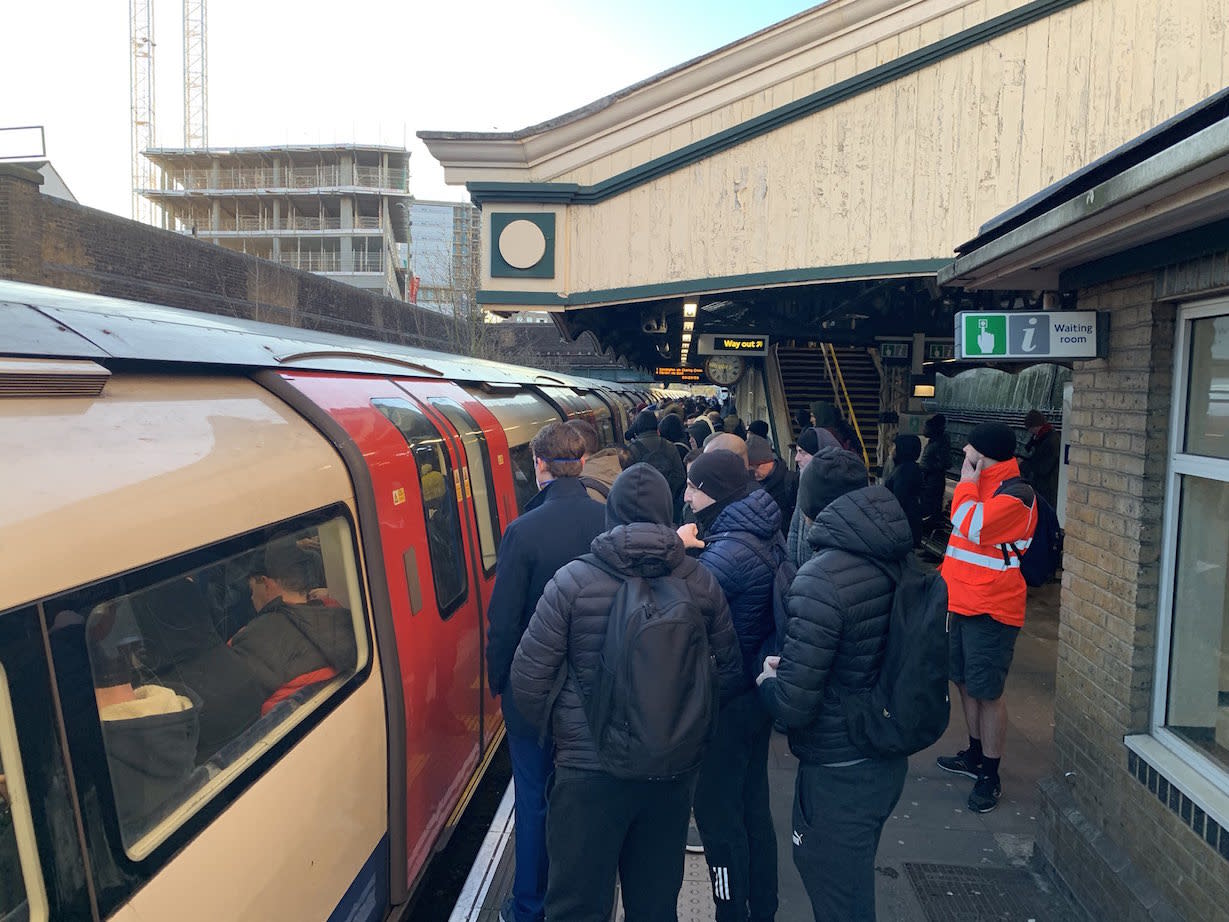Commuters struggle to get on an already packed Northern Line train at Colindale Station in north London on Monday (@kubson84/Twitter)