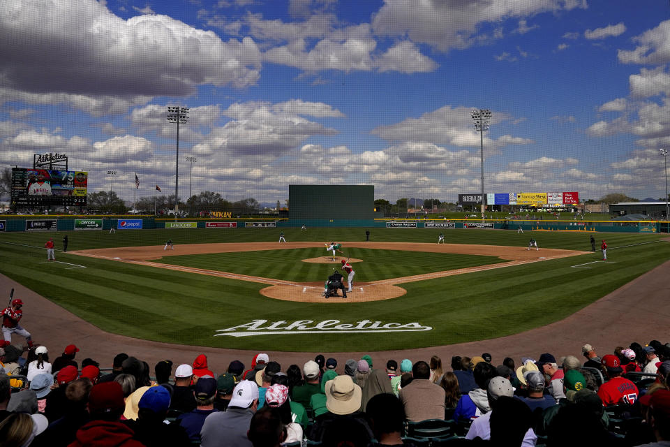 The Los Angeles Angels and the Oakland Athletics compete during the fourth inning of a spring training baseball game, Tuesday, Feb. 28, 2023, in Mesa, Ariz. (AP Photo/Matt York)