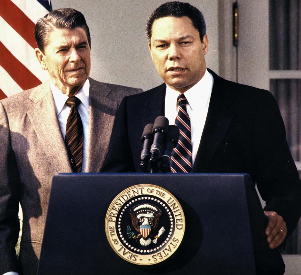 With Ronald Reagan at the White House in 1987 following his appointment as National Security Adviser - CHRIS WILKINS/AFP/Getty Images