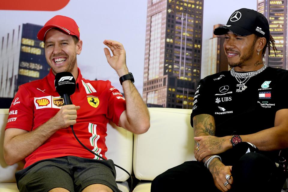 Ferrari's German driver Sebastian Vettel (L) and Mercedes' British driver Lewis Hamilton attend a press conference at the Albert Park circuit ahead of the Formula One Australian Grand Prix in Melbourne on March 12, 2020. (Photo by William WEST / AFP) / -- IMAGE RESTRICTED TO EDITORIAL USE - STRICTLY NO COMMERCIAL USE -- (Photo by WILLIAM WEST/AFP via Getty Images)