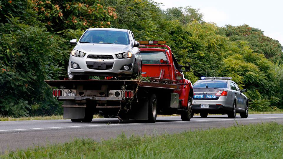 The getaway car of Flanagan is being towed away on a flatbed tow truck after killing two television journalists on LIVE TV, before taking his own life. REUTERS/Kevin Lamarque