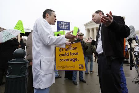 Devon Fagel (L), a physician and cancer survivor, argues in favor of Obamacare with Phil Kerpen (R), who was part of a Tea Party Patriots demonstration against the health care law, in front of the Supreme Court building in Washington March 4, 2015. REUTERS/Jonathan Ernst