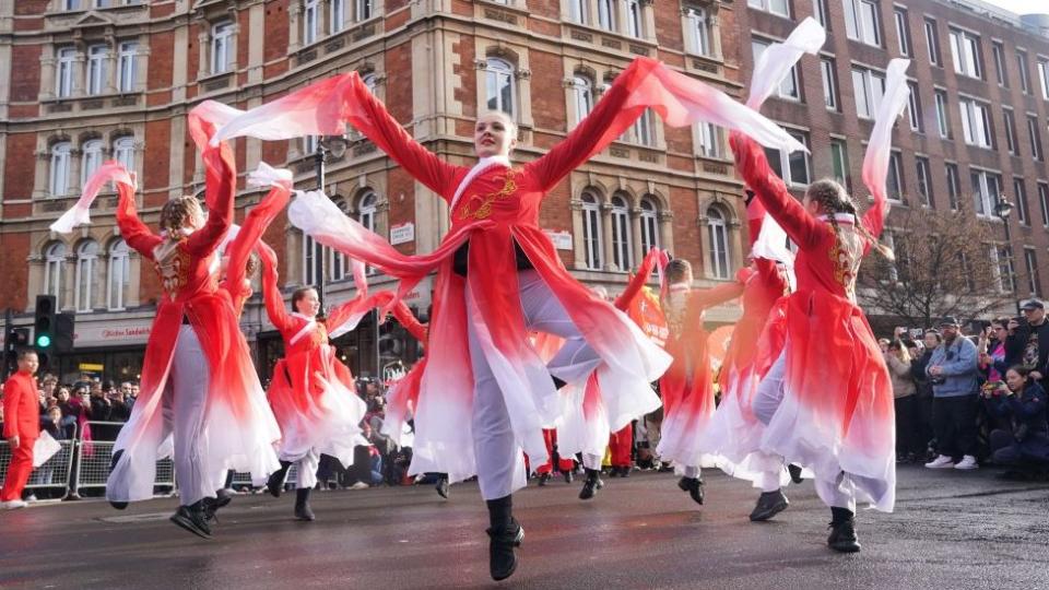 Performers take part in a parade involving costumes, lion dances and floats, to mark the Lunar Year, also known as the Spring Festival or Chinese New Year, in London.