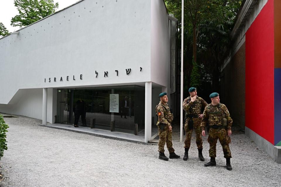 Italian soldiers stand guard in front of the Israeli pavilion during the soft opening of the Venice Biennale art exhibition (AFP via Getty Images)