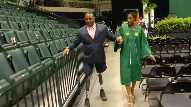 Florida police officer Ricky Carter walked at his daughter Jeniffer’s graduation almost a year on from losing both his legs in an accident. Source: NBC6