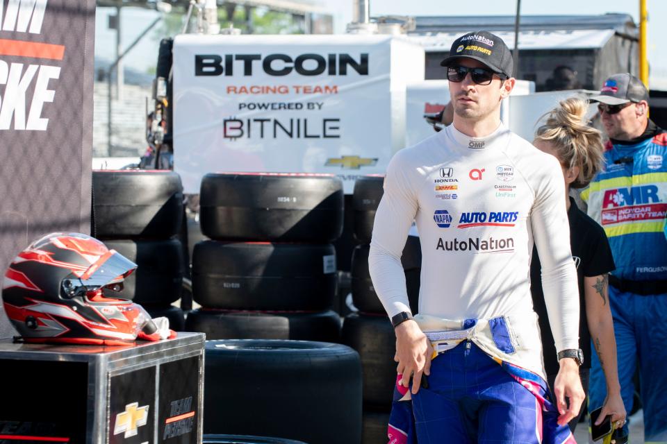 Andretti Autosport driver Alexander Rossi (27) walks pit lane Friday, May 13, 2022, during practice for the GMR Grand Prix at Indianapolis Motor Speedway. 