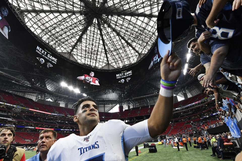 Tennessee Titans quarterback Marcus Mariota gives his hat to fans after an NFL football gameagainst the Atlanta Falcons, Sunday, Sept. 29, 2019, in Atlanta. The Tennessee Titans won 24-10. (AP Photo/John Amis)