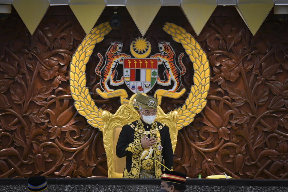 In this photo released by Malaysia's Department of Information, Malaysia's King Sultan Abdullah Sultan Ahmad Shah greets an audience during the opening ceremony of the parliamentary session at parliament house in Kuala Lumpur Monday, May 18, 2020. Malaysia's King said Wednesday, June 16, 2021, that Parliament, which has been suspended under a coronavirus emergency since January, need to resume as soon as possible. (Nazri Rapai/ Malaysia's Department of Information via AP)