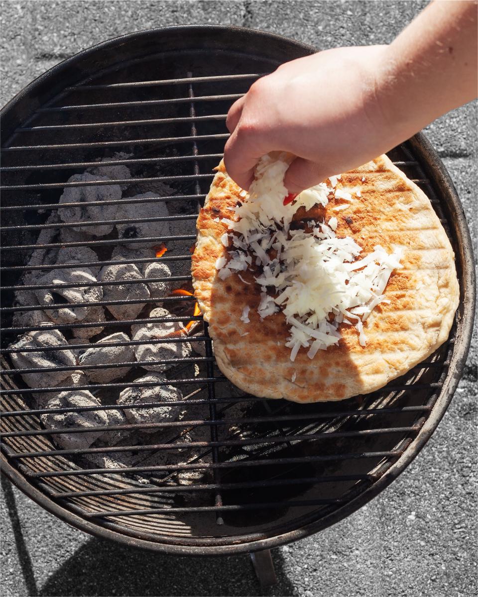 Put the pizza on pause while you add toppings.