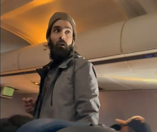 Francisco Severo Torres on board a United Airlines flight from Los Angeles to Boston. (Lisa Olsen)