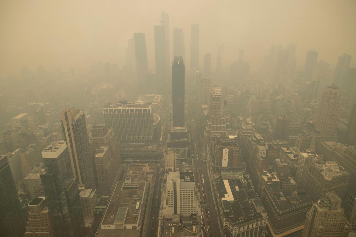 An aerial view shows New York City in a haze-filled sky from the Empire State Building observatory, Wednesday, June. 7, 2023, in New York. ((AP Photo/Yuki Iwamura))