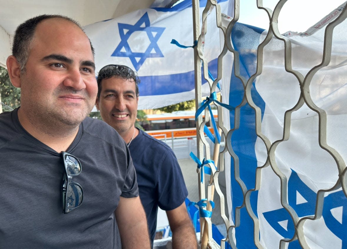 Armed guard Aviad Reed, left, and guide Geoff Winston were part of the traveling party that took Mark Patinkin from Jerusalem to the city of Afula in northern Israel.
