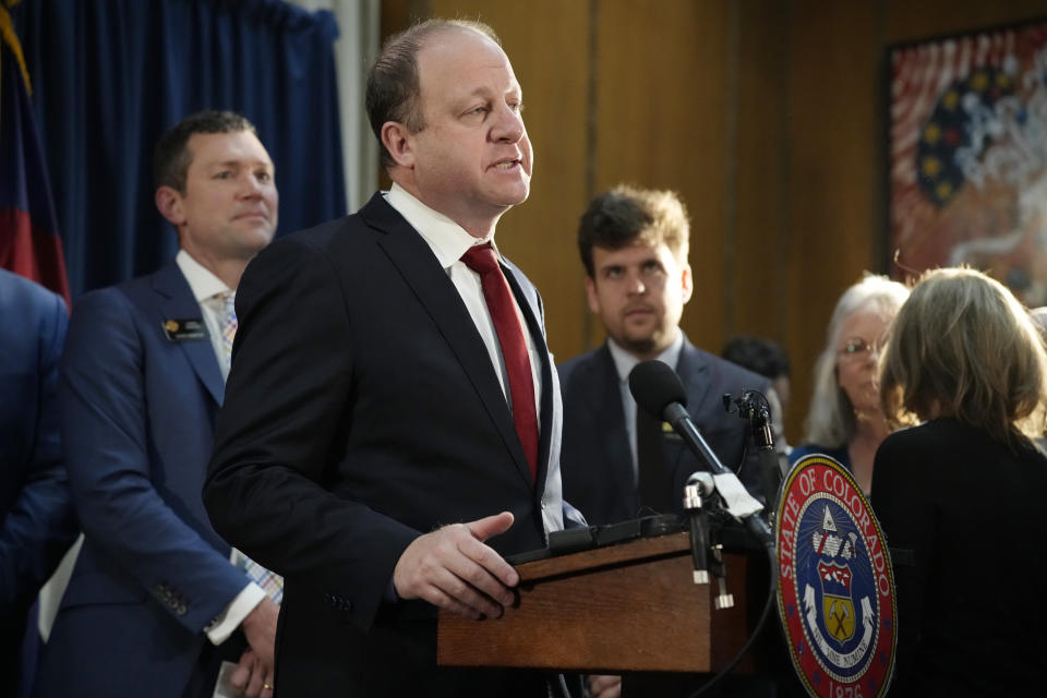 Colorado Gov. Jared Polis speaks before signing four gun control bills, Friday, April 28, 2023, in the State Capitol in Denver. (AP Photo/David Zalubowski)