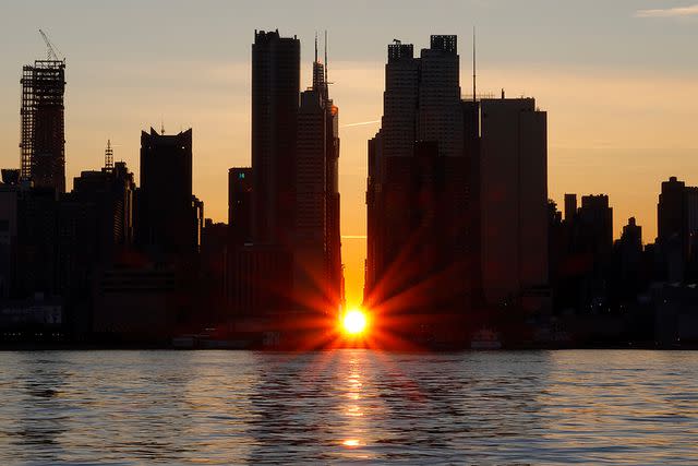 <p>Gary Hershorn/Getty</p> The reverse Manhattanhenge sunrise occurred on Jan. 12, 2024