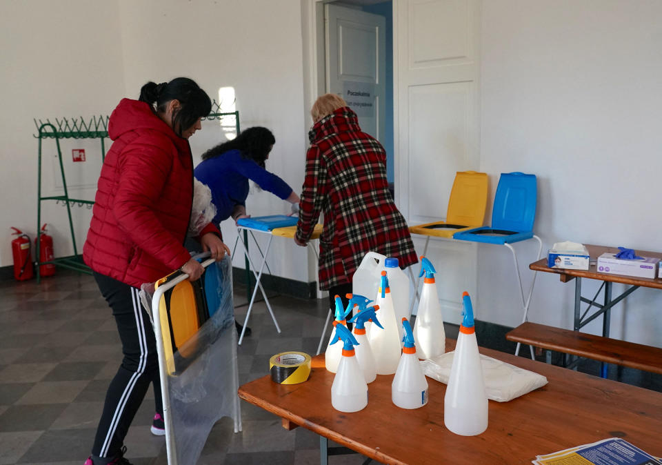 Staff make preparations at a reception centre for Ukrainian refugees in Dorohusk, Poland after Russian President Vladimir Putin authorized a military operation in Ukraine, on Feb. 24.<span class="copyright">Janek Skarzynski—AFP/Getty Images</span>