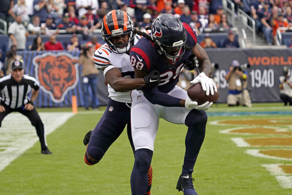 Houston Texans wide receiver Jordan Akins (88) catches a pass for a touchdown as Chicago Bears cornerback Kindle Vildor defends during the first half of an NFL football game Sunday, Sept. 25, 2022, in Chicago. (AP Photo/Nam Y. Huh)