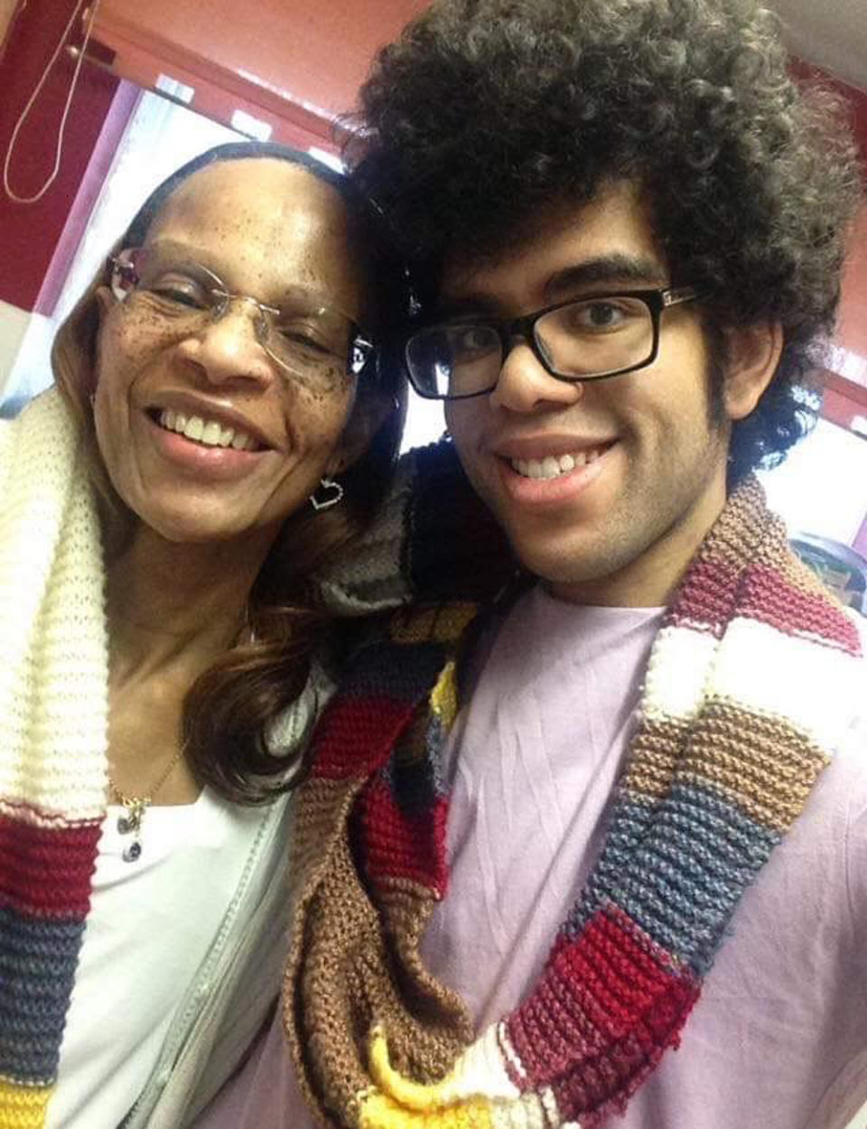 Dominic G. Martin, 27, with his mum, Beverley Greenwood-Martin, 68, and the scarf she knitted him (Collect/PA Real Life)