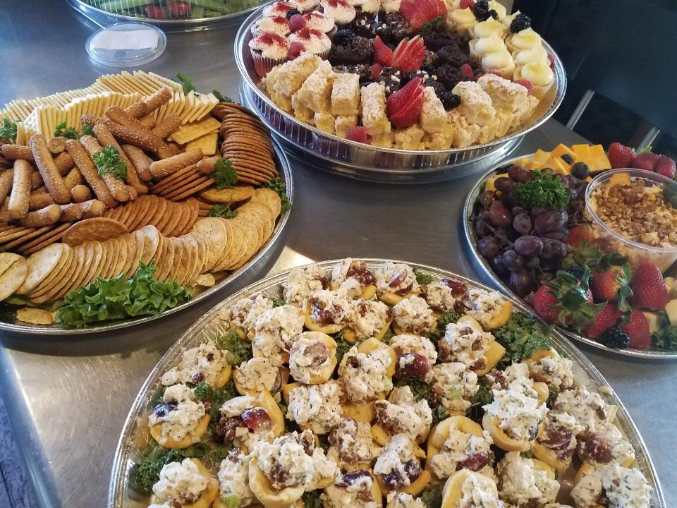 Assorted catering trays available at Crave Cafe in Louisville.