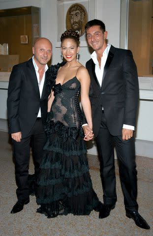 <p>Fairchild Archive/Penske Media via Getty</p> Domenico Dolce, Jennifer Lopez and Stefano Gabbana at the 2004 Met Gala