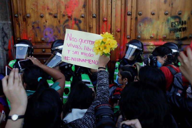 People take part in a protest against gender-based violence in downtown of Mexico City