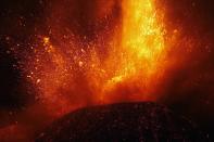 Italy's Mount Etna, Europe's tallest and most active volcano, spews lava as it erupts on the southern island of Sicily November 17, 2013. There were no reports of damage or evacuations in the area and the nearby airport of Catania was operating as normal, local media reported. It is the 16th time that Etna has erupted in 2013. The south-eastern crater, formed in 1971, has been the most active in recent years. REUTERS/Antonio Parrinello (ITALY - Tags: ENVIRONMENT SOCIETY)