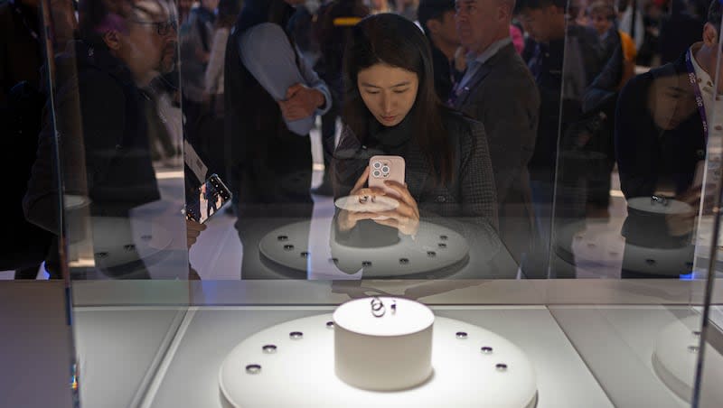 A visitor takes a picture of the Samsung Galaxy Ring during the second day of Mobile World Congress 2024 in Barcelona, Spain, Tuesday, Feb. 27, 2024. The Mobile World Congress kicked off Monday in Barcelona, Spain, with mobile phone makers showing off new devices and telecom industry executives perusing the latest networking gear and software.