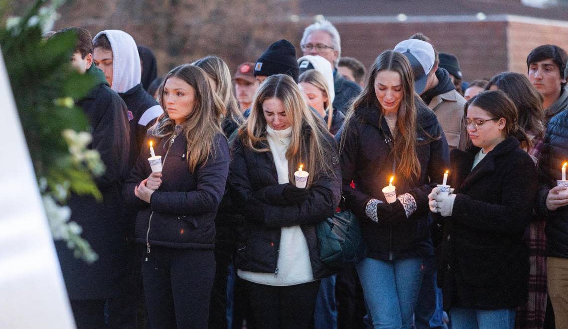 Boise State University students along with people who knew the four University of Idaho students who were found killed in Moscow on Sunday pay their respects at a vigil held in front of a statue on the Boise State campus on Thursday, Nov. 17, 2022. A homicide investigation into the deaths of four University of Idaho students is ongoing.