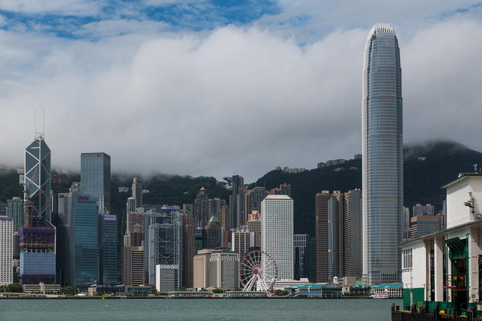 Blue skies and a ray of sunshine are seen over Central Hong Kong and the IFC tower as typhoon Ma On leaves the city and the typhoon alert is lowered to level 3, in Hong Kong , China, on August 25, 2022. (Photo by Marc Fernandes/NurPhoto via Getty Images)